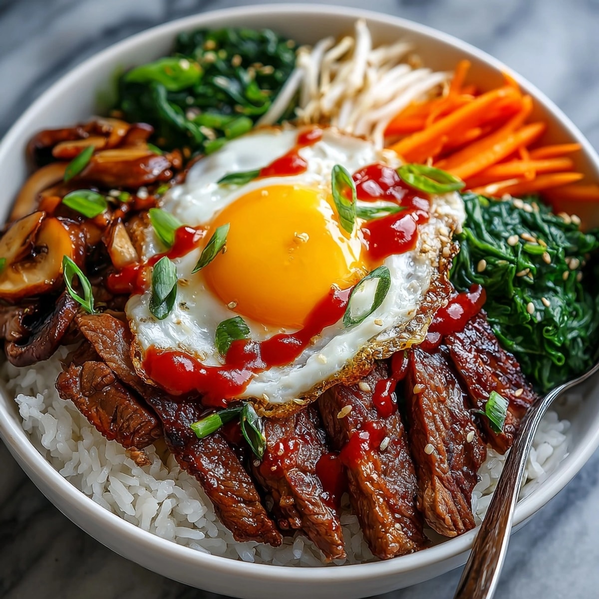 Korean Beef Bibimbap Bowls: Colorful veggies and marinated beef make a flavorful, complete meal.