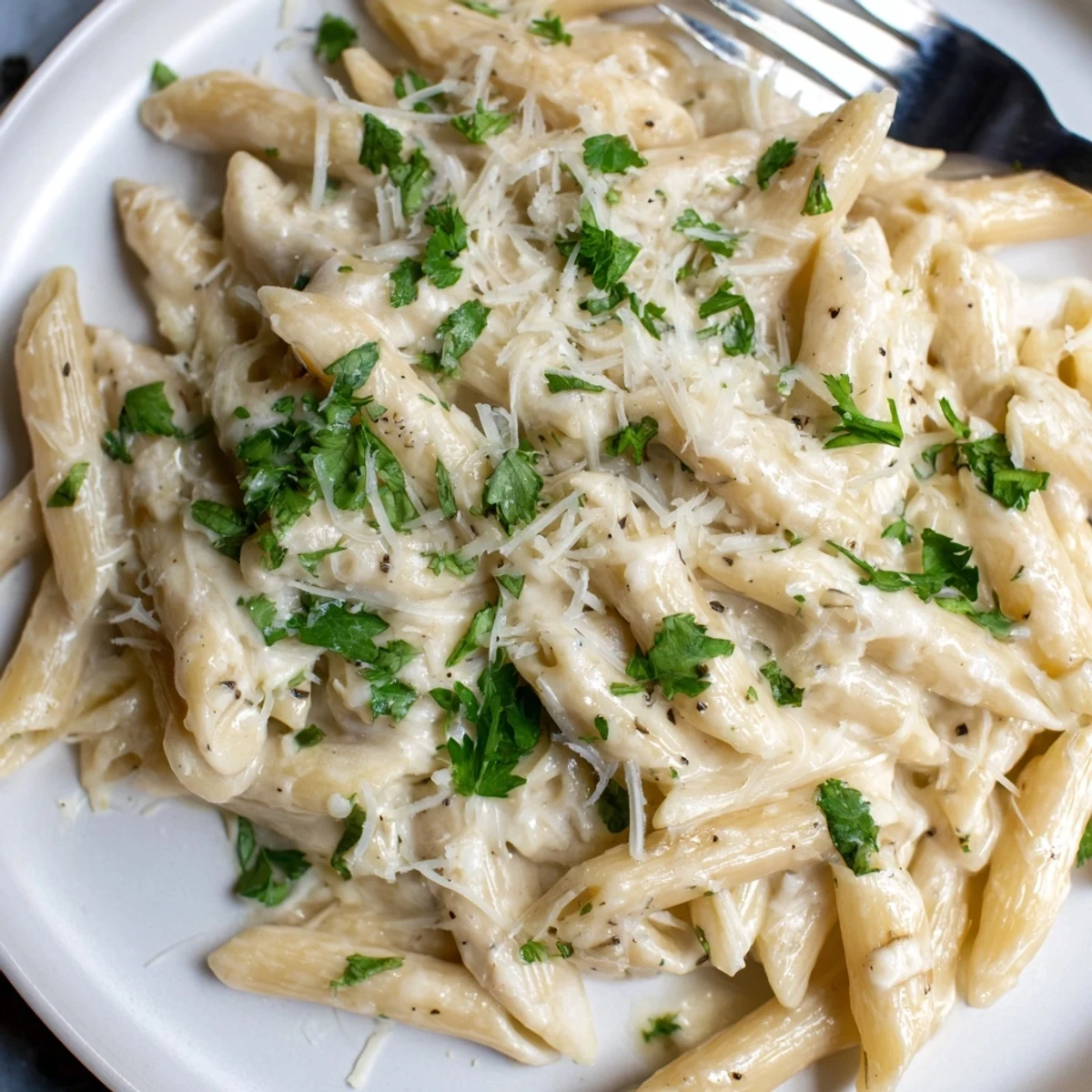 Indulgent Creamy Garlic Penne Pasta, a deliciously rich dish, perfect for any meal.  