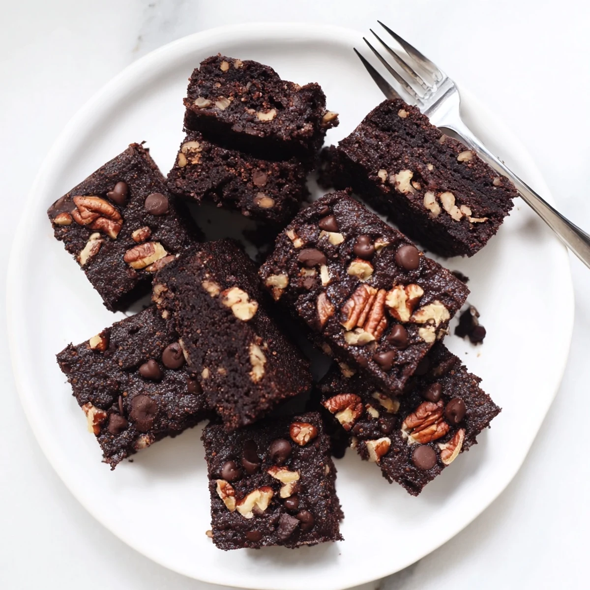 Rich zero-waste brownies made with nut-milk pulp for sustainable indulgence.  