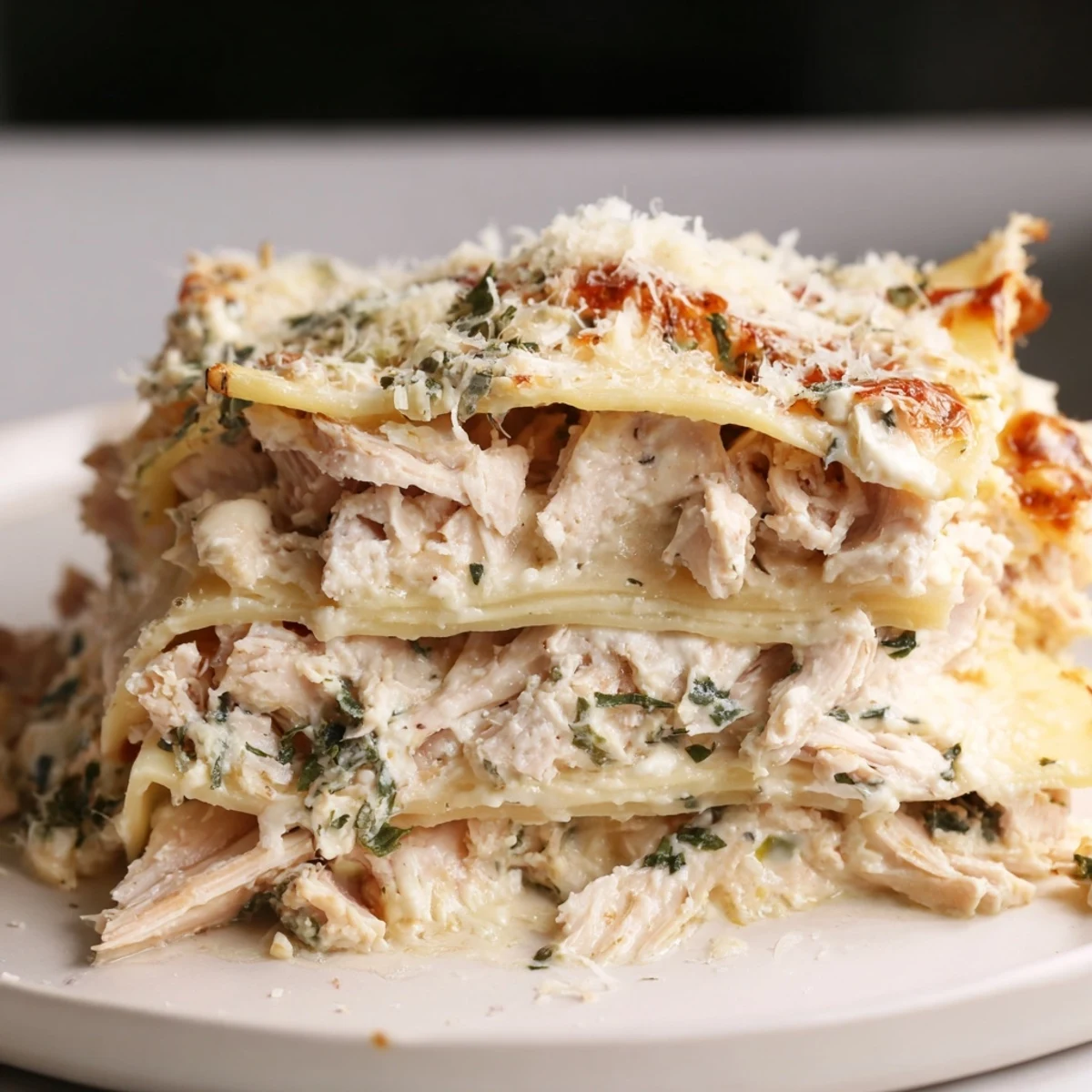 Golden, bubbly Rosemary Chicken Lasagna fresh from the oven, offering savory aromas.