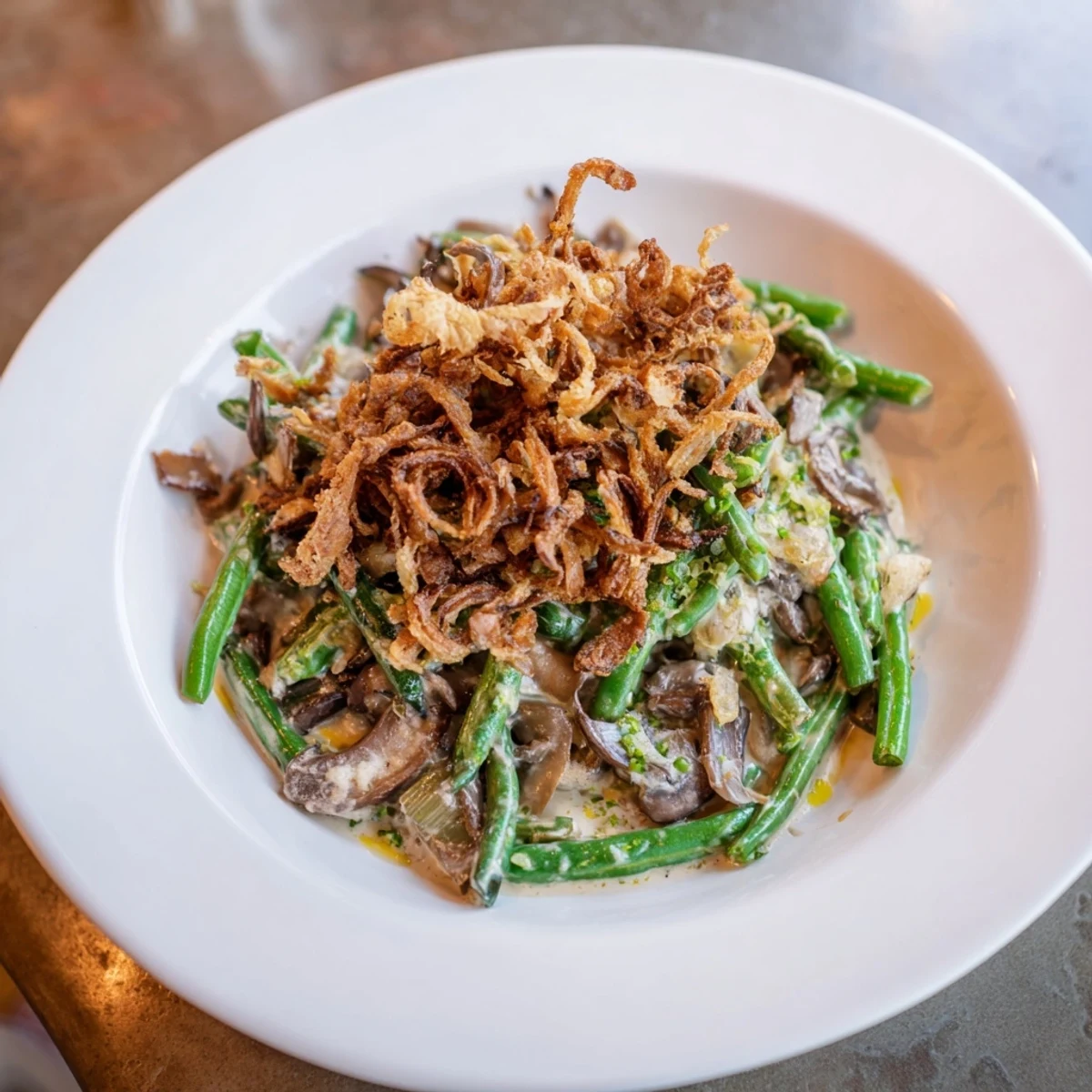 A bubbly, golden-brown Old-School Green Bean Casserole with crispy onions, perfect comfort food.