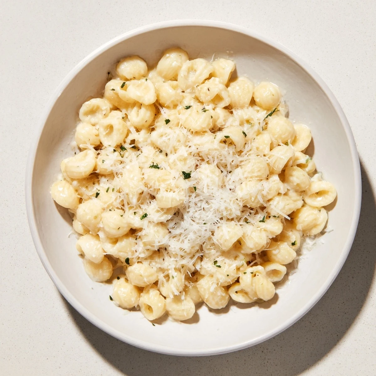 Golden, creamy 15-Minute Garlic Parmesan Pasta, ready to devour with a sprinkle of fresh parsley.