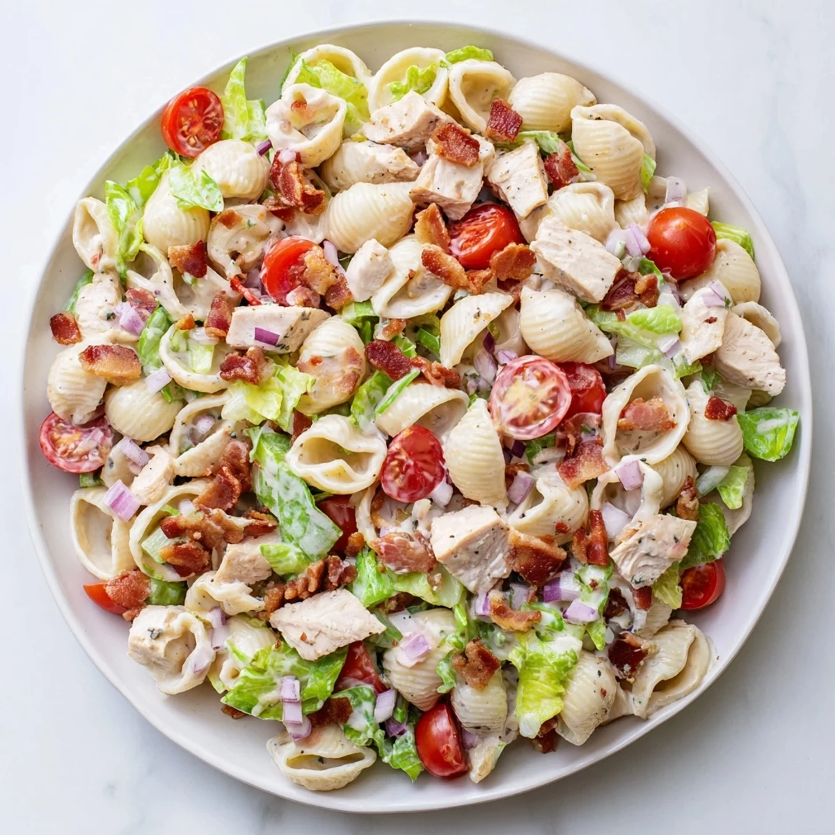 Ready for a picnic or potluck, this American-style main dish salad looks fresh and inviting.