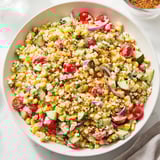 Close-up of a refreshing Mexican Street Corn Chopped Salad, brimming with fresh ingredients and cotija cheese.