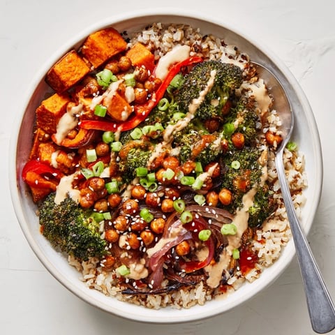 Vibrant Bold Sauce Drizzle Bowls topped with roasted veggies and zesty dressings.  