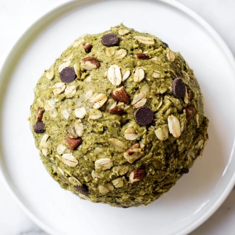 Close-up of Matcha Gingerbread Cookie Dough Protein Bites, with visible texture of rolled oats.