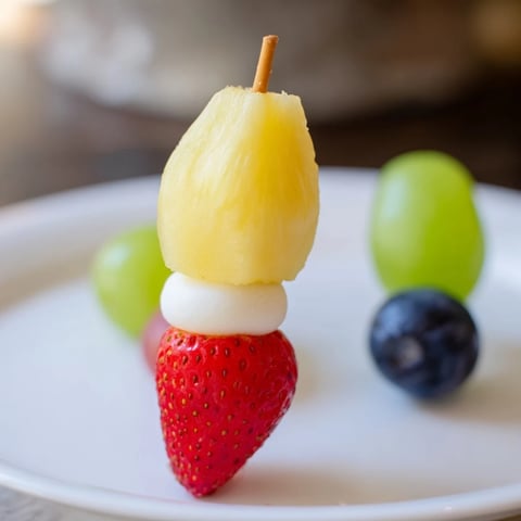 Vibrant Christmas Light Fruit Skewers, a colorful, healthy snack, ready for holiday celebrations.