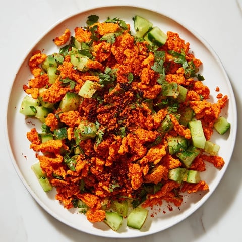 Vibrant Flamin Hot Cheeto Salad with cool cucumber, fresh cilantro, ready for a spicy bite.