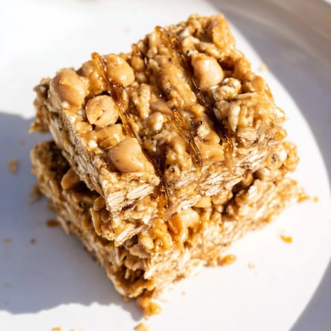 Homemade Peanut Butter Flax Granola Squares: chewy, oaty texture drizzled with melting peanut butter.