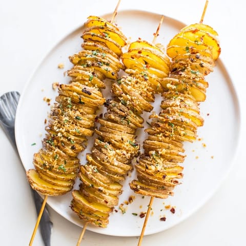 Golden spiral potatoes, lightly seasoned, awaiting your favorite dip and vibrant garnishes.  