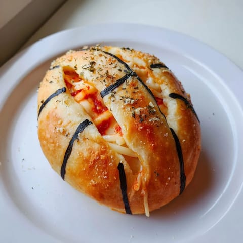 Warm, bite-sized Slam Dunk Basketball Pizza Bites with perfect basketball lines, ideal for a game.