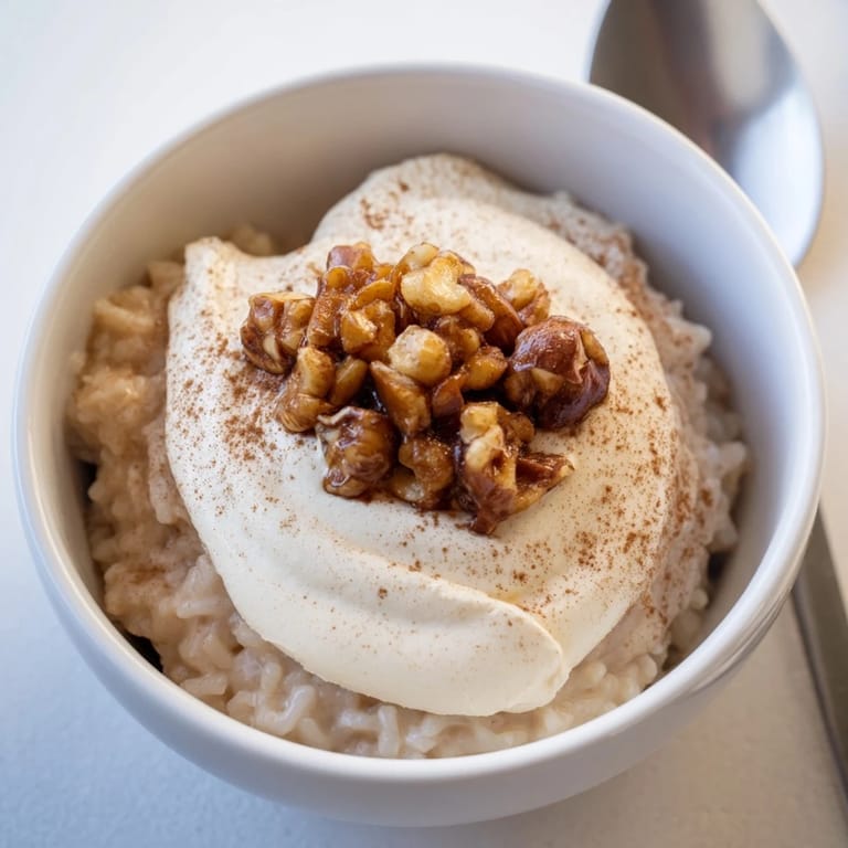 Delightful Japanese rice pudding served warm, adorned with velvety chestnut cream.